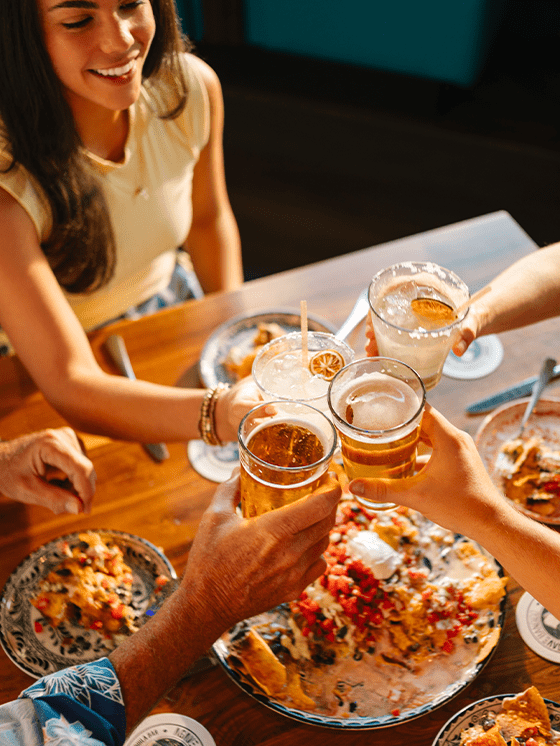 group toasting at dinner