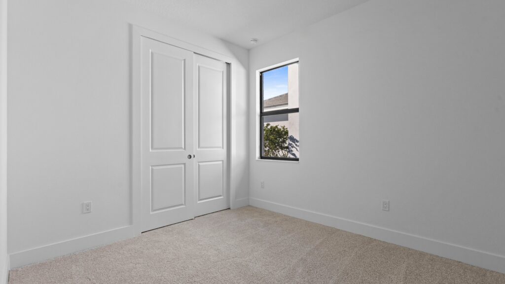 Interior image of move-in ready home showing the second bedroom