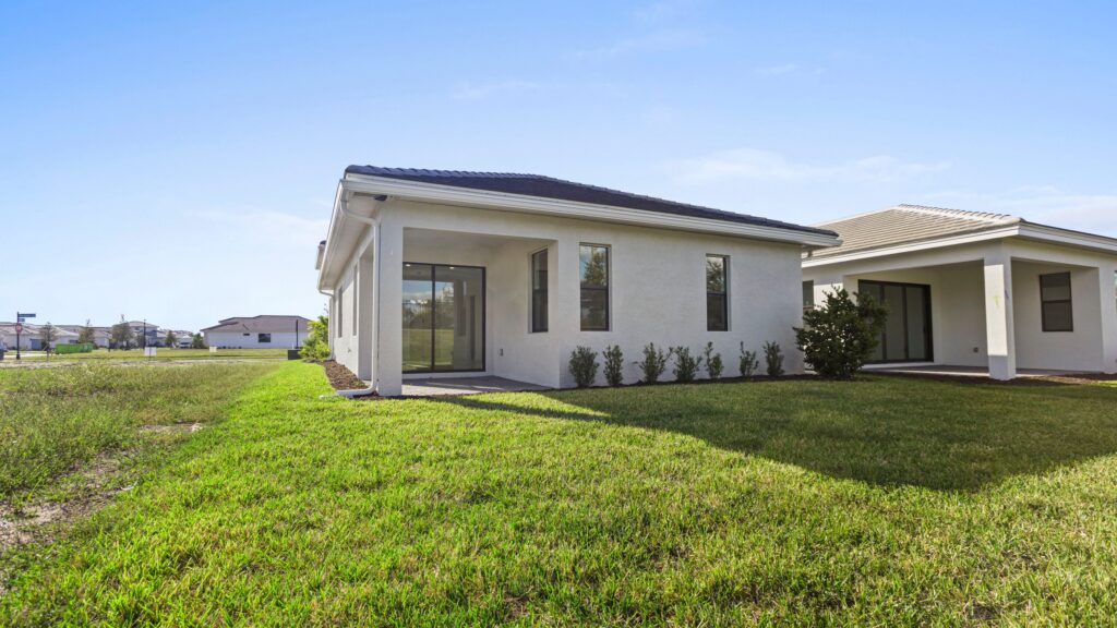 Exterior image of move-in ready home showing the covered lanai